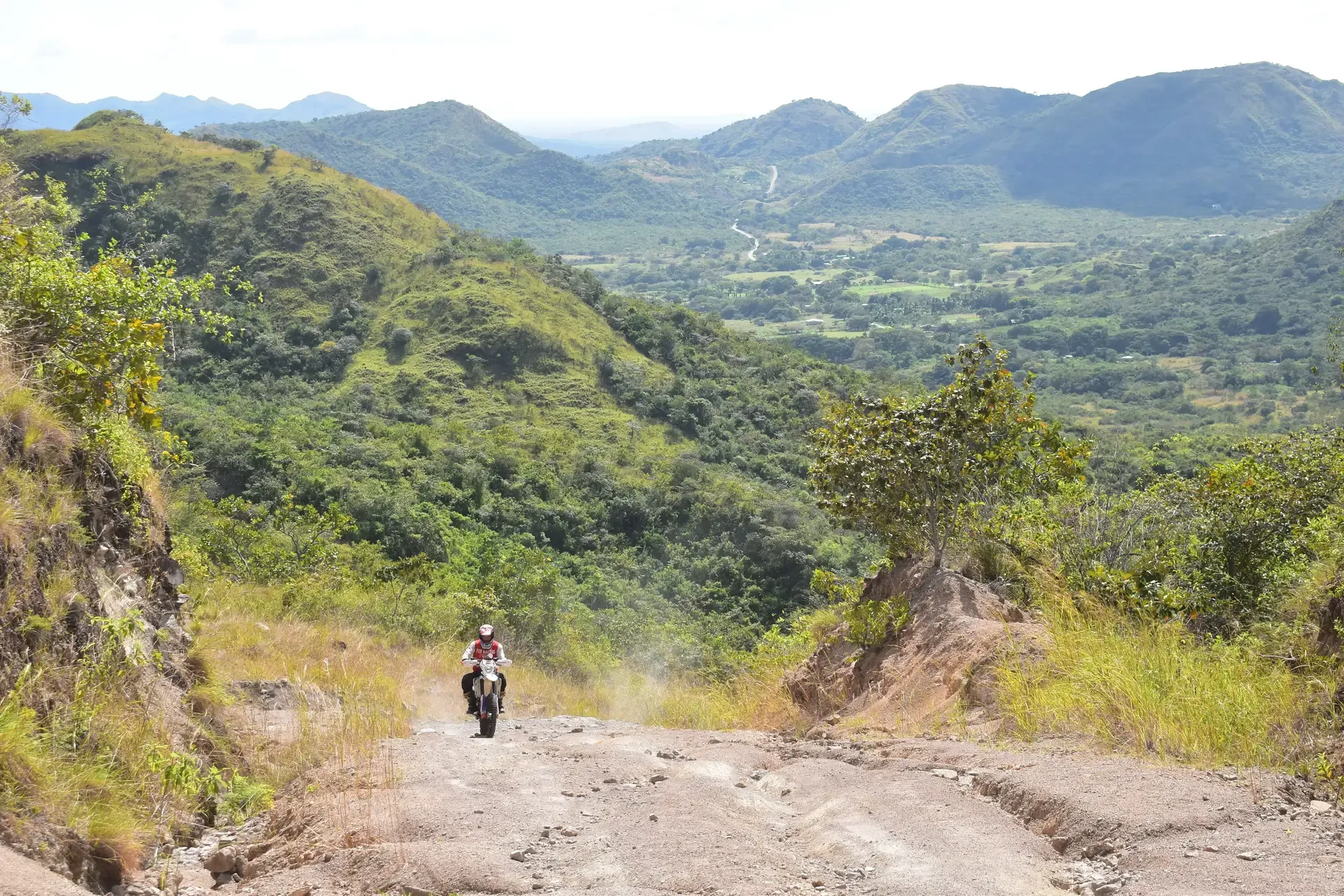 A picture of a motorcycle rider climbing a steep hill in Panama.