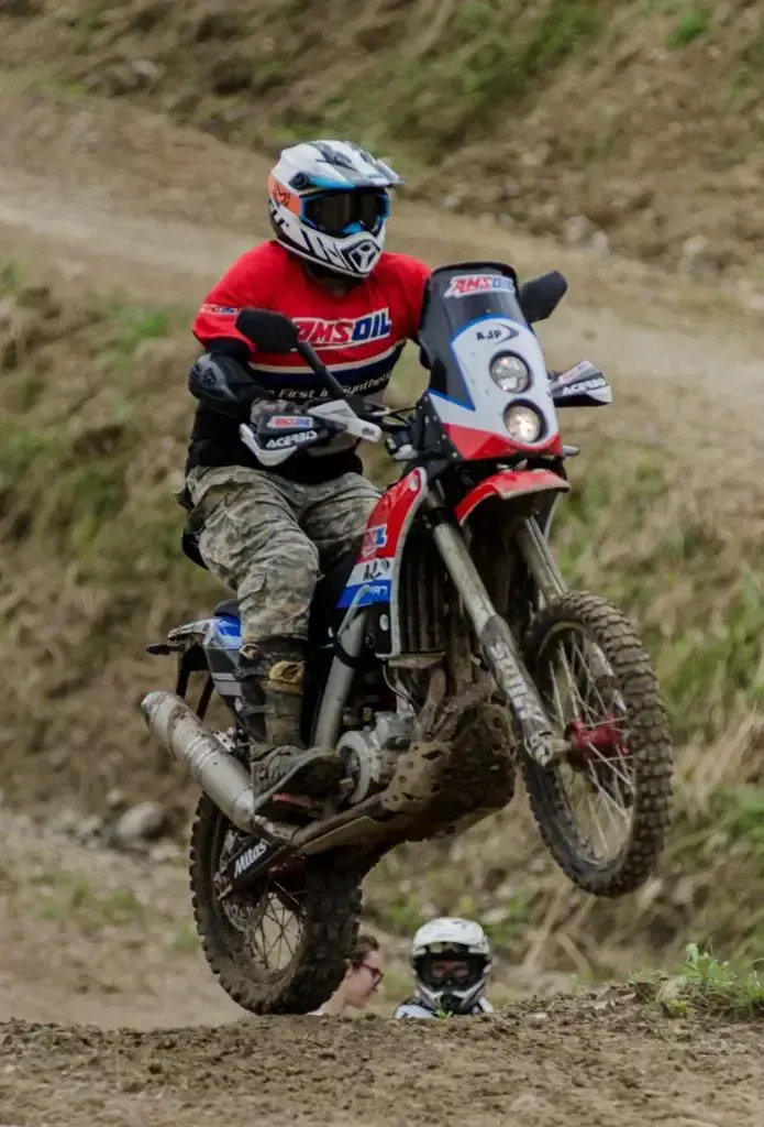 A motorcycle rider in panama riding down a steep hill.